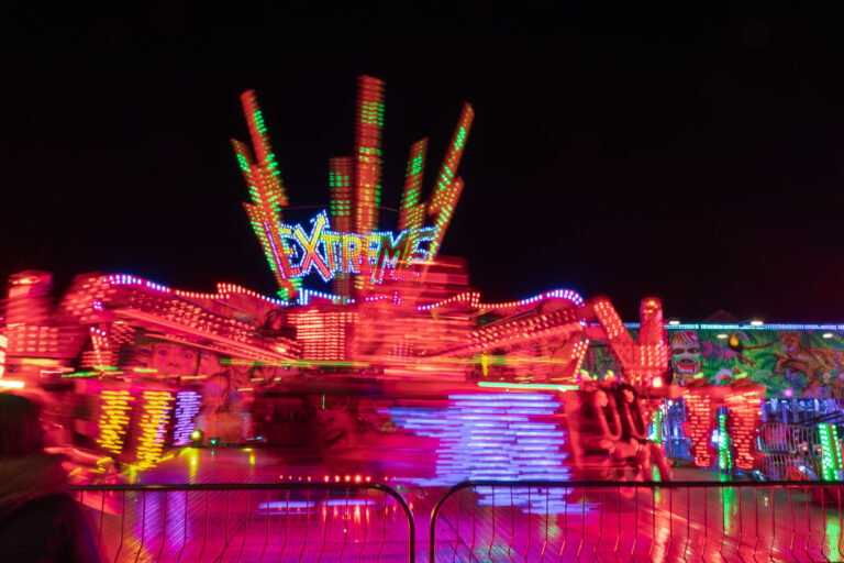 Long exposure night time shot of a fairground ride called Extreme